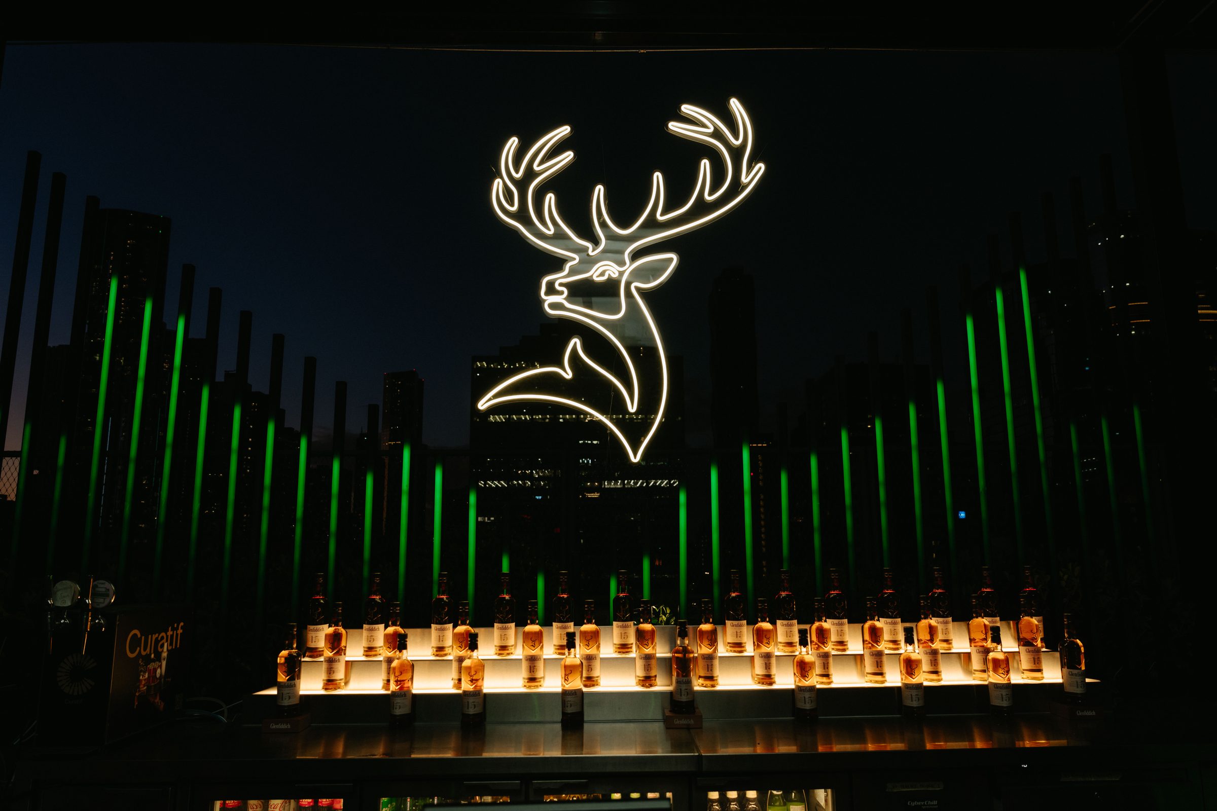 Aston Martin × Glenfiddich activation, wide LED and lighting stage.