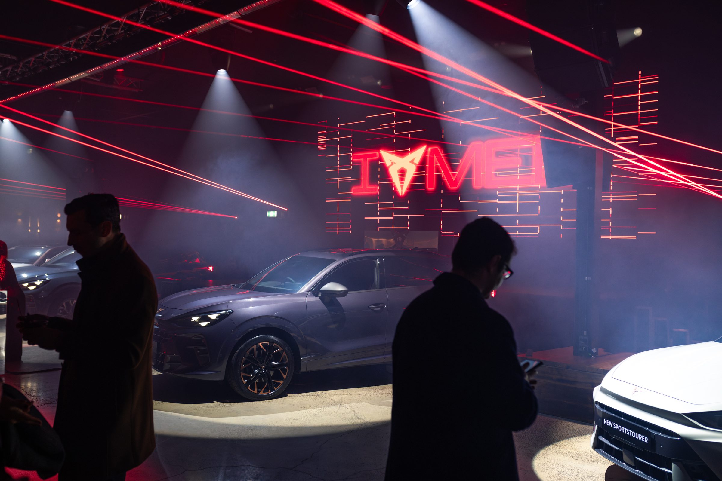 Cupra Banter launch event, saturated red lighting.