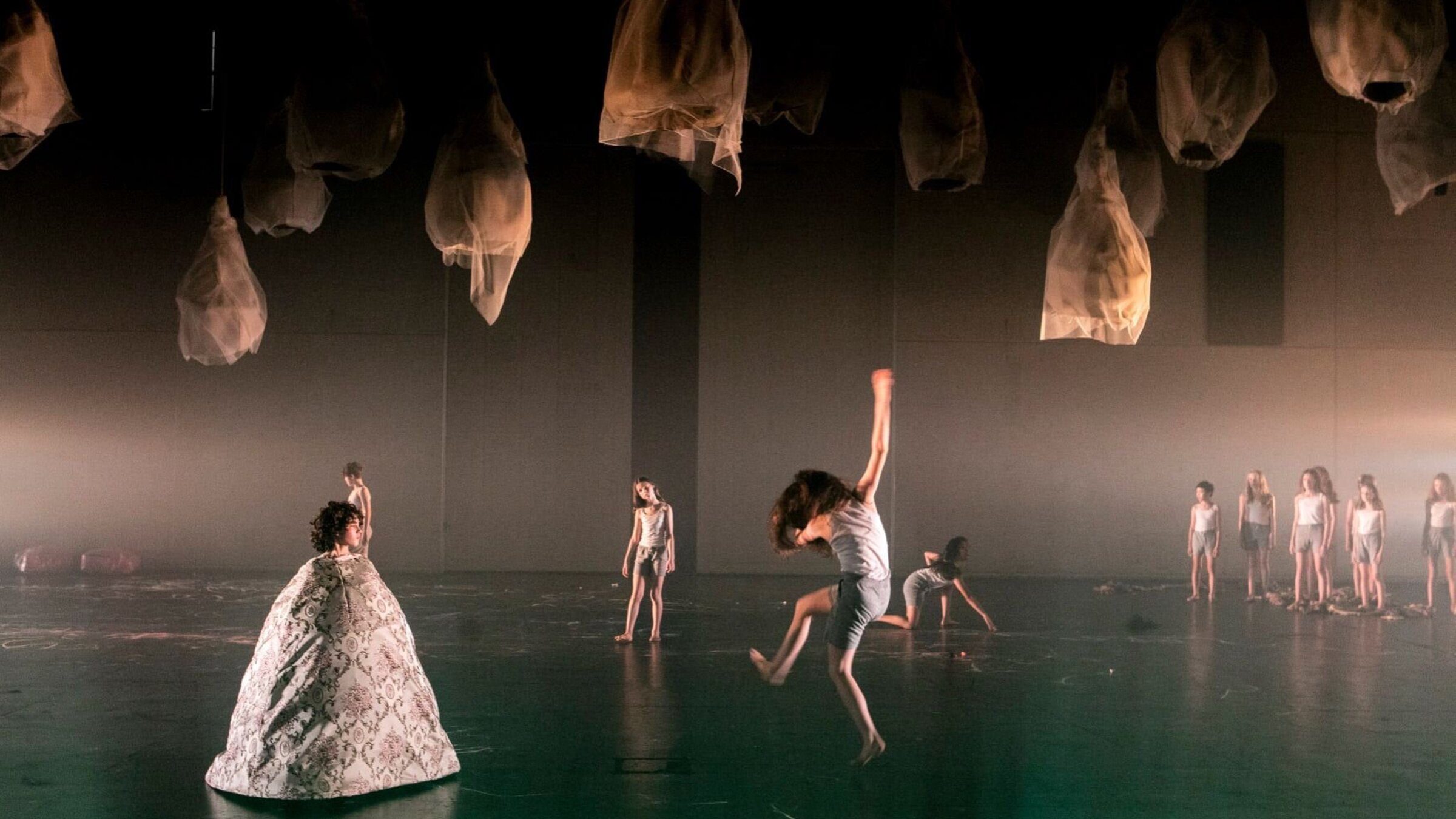 Force Majeure dancers beneath suspended lantern installations, Sydney Chamber Opera.